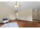 Bright living room showcasing hardwood floors, a ceiling fan, and neutral paint colors at 118 Setter Pt, Clayton, NC 27520