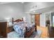Bedroom with vaulted ceilings, a comfortable bed, and an adjoined room with a barn door at 1205 Elysian Way, Rougemont, NC 27572