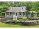 Charming single Gathering house with gray siding, black shutters and dormer windows at 1205 Elysian Way, Rougemont, NC 27572