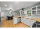 Bright kitchen featuring white cabinets, butcher block countertops, and stainless steel appliances at 1205 Elysian Way, Rougemont, NC 27572