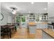 Spacious kitchen featuring white cabinets, butcher block countertops, and hardwood floors at 1205 Elysian Way, Rougemont, NC 27572