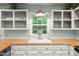 Kitchen features white cabinets, wood countertop, window with sink and neutral paint at 1205 Elysian Way, Rougemont, NC 27572