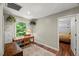 Bright home office with a view of the backyard, showcasing a functional workspace and natural light at 1205 Elysian Way, Rougemont, NC 27572