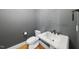 Elegant powder room featuring modern fixtures, toilet, and pedestal sink with stylish hardware at 1210 Brooks Ave, Raleigh, NC 27607