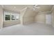 Spacious bedroom with neutral walls, trim, carpet, a ceiling fan, and large window providing natural light at 1210 Brooks Ave, Raleigh, NC 27607