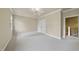 Expansive bedroom with plush carpeting, bright neutral paint, ceiling fan, and a double-door closet at 1210 Brooks Ave, Raleigh, NC 27607