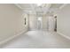 Bright bedroom features a tray ceiling with fan, carpet, and neutral wall color at 1210 Brooks Ave, Raleigh, NC 27607
