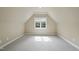 Cozy bedroom with carpeted floors, neutral paint, and a window offering plenty of natural light at 1210 Brooks Ave, Raleigh, NC 27607