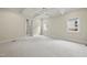Spacious bedroom featuring a coffered ceiling, carpeted floor, and plenty of natural light at 1210 Brooks Ave, Raleigh, NC 27607