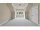 Cozy bedroom features carpeted floors, a ceiling fan, and a window offering natural light at 1210 Brooks Ave, Raleigh, NC 27607