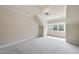 Bright bedroom with carpeted flooring, neutral paint, and a ceiling fan, offering comfort and style at 1210 Brooks Ave, Raleigh, NC 27607
