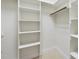 Walk-in closet offering ample storage space with custom shelving and hanging rod at 1210 Brooks Ave, Raleigh, NC 27607