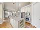 Eat-in kitchen with stainless steel appliances, granite countertops, and center island, providing space to cook at 1210 Brooks Ave, Raleigh, NC 27607