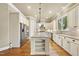 Eat-in kitchen features stainless steel appliances, granite countertops, and a center island with ample storage at 1210 Brooks Ave, Raleigh, NC 27607