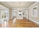 Open living space boasts hardwood floors, neutral paint, and an open fireplace visible from entryways at 1210 Brooks Ave, Raleigh, NC 27607