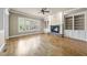 Inviting living room features hardwood floors, built-in shelving, and a stone fireplace at 1210 Brooks Ave, Raleigh, NC 27607