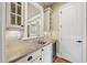 Wet bar featuring stone countertops, wine cooler, and convenient access to serving beverages in style at 1210 Brooks Ave, Raleigh, NC 27607