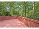 Wood deck overlooking a green, wooded backyard at 124 Twin Oaks Pl, Cary, NC 27511