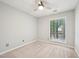 Neutral bedroom with a ceiling fan and large window at 124 Twin Oaks Pl, Cary, NC 27511