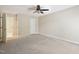 Spacious bedroom with neutral paint, ceiling fan, and plush carpeting at 124 Twin Oaks Pl, Cary, NC 27511