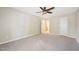 A spacious bedroom is bright with natural light, has a ceiling fan, and neutral walls at 124 Twin Oaks Pl, Cary, NC 27511