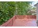 Spacious outdoor deck offers a tranquil retreat surrounded by lush greenery and mature trees at 124 Twin Oaks Pl, Cary, NC 27511