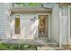 Home entrance with a storm door, window, and painted siding, leading into the house at 124 Twin Oaks Pl, Cary, NC 27511