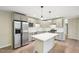 Modern kitchen with stainless steel appliances, island, granite countertops, and stylish cabinets at 124 Twin Oaks Pl, Cary, NC 27511