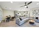 Spacious living room with dining area and modern kitchen with gray cabinetry and stainless steel appliances at 124 Twin Oaks Pl, Cary, NC 27511
