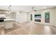 Bright living room featuring modern fixtures, fireplace, new floors and lots of natural light at 124 Twin Oaks Pl, Cary, NC 27511