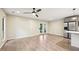 Open floorplan features a kitchen with stainless appliances and a living area with access to outdoor space at 124 Twin Oaks Pl, Cary, NC 27511