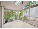 Bright screened porch with views of the yard from all angles, and ceiling skylight at 124 Twin Oaks Pl, Cary, NC 27511