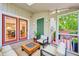 Cozy sunroom featuring comfortable seating, a modern fire pit, and lots of light at 124 Twin Oaks Pl, Cary, NC 27511