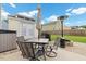 Backyard patio with seating and dining area, umbrella, grill and backyard shed at 13 Toplanders Ter, Gibsonville, NC 27249