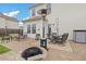 The private backyard patio has an outdoor dining area, seating and stone firepit at 13 Toplanders Ter, Gibsonville, NC 27249