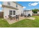 Backyard patio with outdoor seating, dining area, grill, shed and green grass at 13 Toplanders Ter, Gibsonville, NC 27249