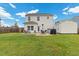 Large, grassy backyard with patio, grill, seating area and storage shed at 13 Toplanders Ter, Gibsonville, NC 27249