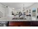Stylish kitchen with granite countertops, stainless steel sink, and a view into the living spaces at 13 Toplanders Ter, Gibsonville, NC 27249