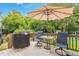 Outdoor deck featuring a grill, seating, and shade umbrella, perfect for entertaining or relaxing at 1428 White Opal Dr, Knightdale, NC 27545