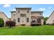 Large backyard with a deck, green lawn, and serene surroundings, perfect for enjoying the outdoors at 1428 White Opal Dr, Knightdale, NC 27545
