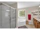 This bathroom features a bathtub, shower, and double sink vanity at 1428 White Opal Dr, Knightdale, NC 27545