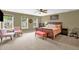 Spacious bedroom with natural light, ceiling fan, and tasteful furniture at 1428 White Opal Dr, Knightdale, NC 27545