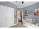 Bedroom featuring a closet and a sofa, perfect for relaxation at 1428 White Opal Dr, Knightdale, NC 27545