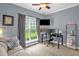This bedroom features a dedicated workspace, ideal for remote work or study at 1428 White Opal Dr, Knightdale, NC 27545