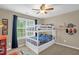 Bright bedroom with a bunk bed, large window, and playful décor, perfect for  at 1428 White Opal Dr, Knightdale, NC 27545