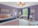 Charming bedroom with a cozy bed, desk area, and bright window for a peaceful retreat at 1428 White Opal Dr, Knightdale, NC 27545