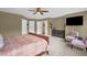 Large primary bedroom with TV and nice chairs at 1428 White Opal Dr, Knightdale, NC 27545