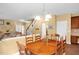 Cozy dining room with a classic wooden table and chairs, next to the living room at 1428 White Opal Dr, Knightdale, NC 27545