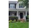 Charming home exterior with a welcoming front porch, decorative columns, and well-maintained landscaping at 1428 White Opal Dr, Knightdale, NC 27545