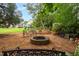 Inviting backyard firepit with seating area, ideal for outdoor gatherings and relaxation at 1428 White Opal Dr, Knightdale, NC 27545